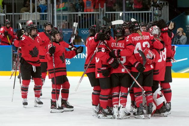 February 14, 2026, Milan, ITALY: Canada players celebrate the team s 5-1 win over Germany following the third period of a women s hockey quarterfinal game at the 2026 Winter Olympics, in Milan, Saturday, Feb. 14, 2026. Canada News - February 14, 2026  - ZUMAc35_ 20260214_zaf_c35_090 Copyright: xDarrylxDyckx