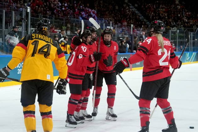 February 14, 2026, Milan, ITALY: La Canadienne Marie-Philip Poulin (29) co loÂ¨bre son but avec ses coo quipioÂ¨res lors de la troisioÂ¨me po riode du quart de finale de hockey fo minin contre l Allemagne aux Jeux olympiques d hiver de 2026, o Milan, le samedi 14 fo vrier 2026. LA PRESSE CANADIENNE Canada News - February 14, 2026  - ZUMAc35_ 20260214_zaf_c35_091 Copyright: xDarrylxDyckx