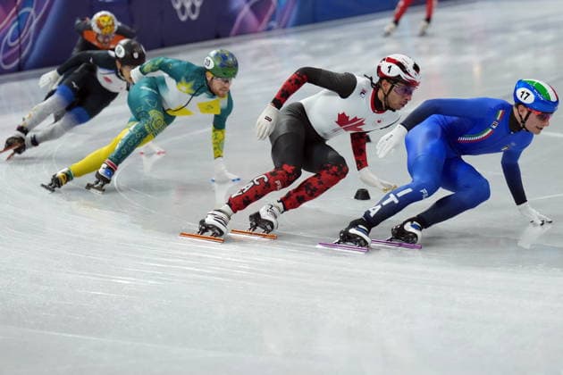 February 14, 2026, Milan, ITALY: Canada s William Dandjinou (1) competes in the Men s quarterfinals 1500m Short Track Speed skating, Eisschnelllauf event during the 2026 Milan Cortina Winter Olympics in Milan, Italy on Saturday, February 14, 2026. Canada News - February 14, 2026  - ZUMAc35_ 20260214_zaf_c35_115 Copyright: xNathanxDenettex
