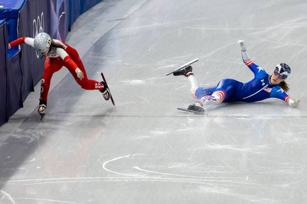 February 14, 2026, Milano, Lombardy, Italy: Corinne Stoddard (3) of the United States crashes and ties to finish the race is is beat to the finish line by Gabriela Topolska (33) of Poland in Short Track Speed skating, Eisschnelllauf Women 1000m heats during the 2026 Winter Olympics at the Milano Ice Skating Arena on Saturday in Milano. Olympics 2026: Milano Cortina: Short Track Speed Skating Women s  - ZUMAj89_ 20260214_oly_j89_005 Copyright: xPaulxKitagakixJr.x