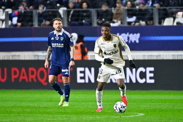 FOOTBALL : Paris FC vs Lens - Ligue 1 - 14 02 2026 Mamadou Sangare ( 8 - Lens ) and Ciro Immobile ( 36 - PFC ) during the Ligue 1 match between Paris FC and RC Lens at Stade Jean Bouin on February 14, 2026 in Paris, France. ( Photo by Federico Pestellini PsnewZ ) - ParisFrance  Copyright: xFedericoxPestellinix