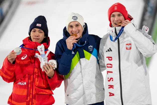 Ski jumping, Skispringen, Ski, nordisch - Milano Cortina 2026 Winter Olympics Day 8 Silver medallist Japan s Ren Nikaido (R), gold medallist Slovenia s Domen Prevc (2ndR) and bronze medallist Poland s Kacper Tomasiak (L) celebrate after the men s large hill individual ski jumping of the Milano Cortina 2026 Winter Olympic Games, Olympische Spiele, Olympia, OS at Predazzo Ski Jumping Stadium in Predazzo (Val di Fiemme), on February 14, 2026. Tesero Italy  Copyright: xAndrzejxIwanczukx originalFilename:iwanczuk-skijumpi260214_npiXE.jpg