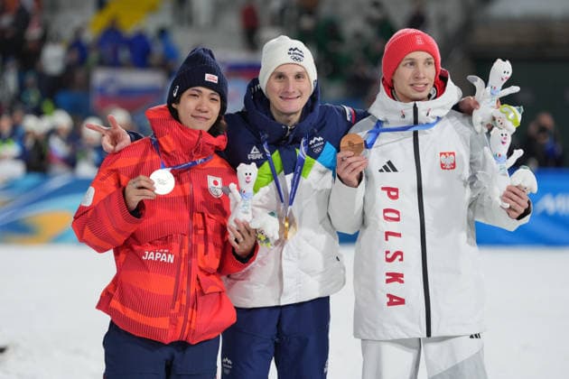 Milano Cortina 2026 Olympic Winter games, Winterspiele,Spiele, Summer games MILAN, ITALY - FEBRUARY 14: Slovenian athlete Domen Prevc (C) wins gold medal, Japanese athlete Ren Nikaido (L) wins silver medal and Polish athlete Kacper Tomasiak (R) wins bronze medal in the men’s large hill Ski jumping, Skispringen, Ski, nordisch event during the Milano-Cortina 2026 Winter Olympic Games, Olympische Spiele, Olympia, OS in Milan, Italy, on February 14, 2026. Cemal Yurttas Anadolu Milan Italy. Editorial use only. Please get in touch for any other usage.  Copyright: x2026xAnadoluxCemalxYurttasx