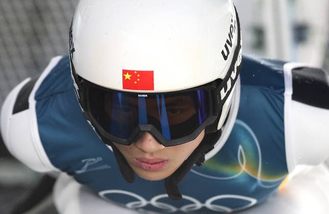 (260214) -- PREDAZZO, Feb. 14, 2026 -- Song Qiwu of China competes during the trial round of Ski jumping, Skispringen, Ski, nordisch men s large hill individual event at the Milan-Cortina 2026 Olympic Winter games, Winterspiele,Spiele, Summer games in Predazzo, Italy, Feb. 14, 2026. ) (MICO2026)ITALY-PREDAZZO-OLYMPIC WINTER GAMES-SKI JUMPING-MEN S LARGE HILL INDIVIDUAL HuangxWei 
