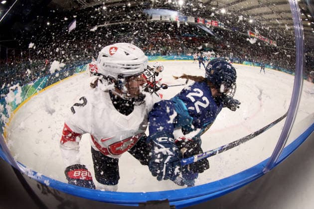 February 14, 2026, Milan, Lombardy, Italy: Julia Schalin 22 of Team Finland and Annic Buchi 2 of Team Switzerland in a women s Ice hockey, Eishockey quarterfinal during the Milano Cortina 2026 Olympic Winter games, Winterspiele,Spiele, Summer games at Milano Rho Ice Hockey Arena. Olympics 2026: Milano Cortina: Ice Hockey-Women Quarterfinal - FIN-SUI  - ZUMAm117 20260214_oly_m117_006 Copyright: xDavidxMcIntyrex