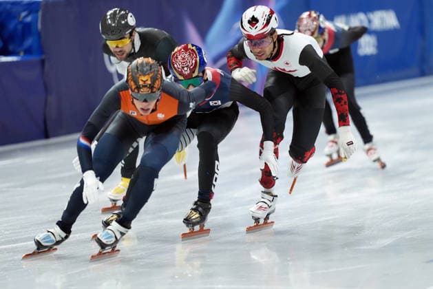 February 14, 2026, Milan, ITALY: Canada s William Dandjinou competes in the Men s 1500m Short Track Speed skating, Eisschnelllauf final during the 2026 Milan Cortina Winter Olympics in Milan, Italy on Saturday, February 14, 2026. Canada News - February 14, 2026  - ZUMAc35_ 20260214_zaf_c35_194 Copyright: xNathanxDenettex