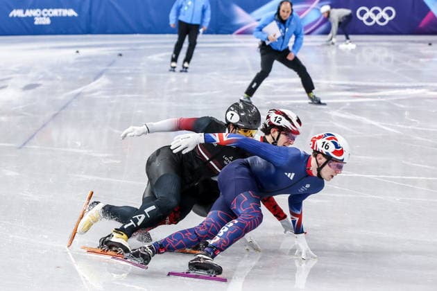 ITALY, MILAN - FEBRUARY 14, 2026: Roberts Kruzbergs of Latvia, Niall Treacy (L-R front) of the UK and Felix Roussel of Canada compete in the men s 1,500m short-track Speed skating, Eisschnelllauf semifinals during the 2026 Winter Olympic Games, Olympische Spiele, Olympia, OS at the Milano Ice Skating Arena. Peter Kovalev TASS  88719702