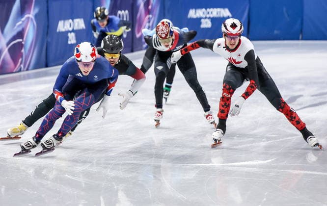 ITALY, MILAN - FEBRUARY 14, 2026: Niall Treacy (L) of the UK and Felix Roussel (R) of Canada compete in the men s 1,500m short-track Speed skating, Eisschnelllauf semifinals during the 2026 Winter Olympic Games, Olympische Spiele, Olympia, OS at the Milano Ice Skating Arena. Peter Kovalev TASS  88719779