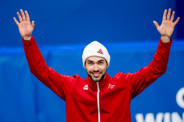 Milano Cortina 2026 Winter Olympics, Short Track Speed skating, Eisschnelllauf Italy Third Roberts Kruzbergs of Latvia celebrating during the medal ceremony after competing on the Short Track Speed Skating Men s 1500m Finals on Day 8 of the Milano Cortina 2026 Winter Olympics at the Milano Speed Skating Stadium in Milan, Italy, February 14, 2026. Milan Italy  Copyright: xMatrixxImagesx xHenkxJanxDijksx