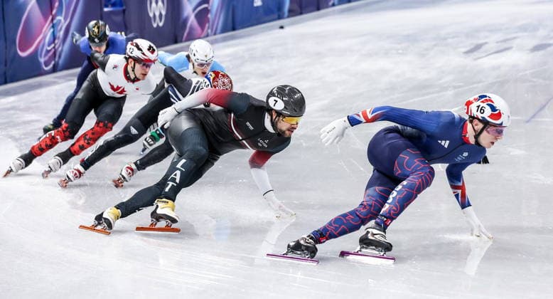 ITALY, MILAN - FEBRUARY 14, 2026: Niall Treacy of the UK and Roberts Kruzbergs (R-L) of Latvia compete in the men s 1,500m short-track Speed skating, Eisschnelllauf semifinals during the 2026 Winter Olympic Games, Olympische Spiele, Olympia, OS at the Milano Ice Skating Arena 2026 Winter Olympics: Short-Track Speed Skating  - ZUMAt113 20260214_zaa_t113_425 Copyright: xPeterxKovalevx