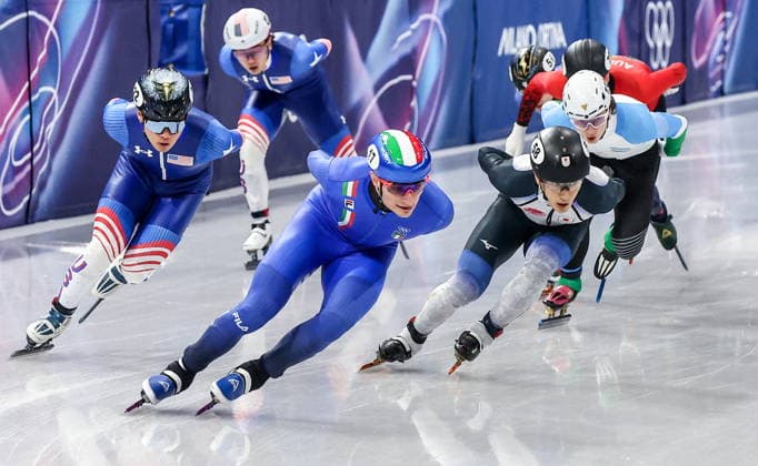 ITALY, MILAN - FEBRUARY 14, 2026: Andrew Heo of the US, Luca Spechenhauser of Italy and Keita Watanabe (L-R front) of Japan compete in Final B of the men s 1,500m short-track Speed skating, Eisschnelllauf event during the 2026 Winter Olympic Games, Olympische Spiele, Olympia, OS at the Milano Ice Skating Arena 2026 Winter Olympics: Short-Track Speed Skating  - ZUMAt113 20260214_zaa_t113_429 Copyright: xPeterxKovalevx