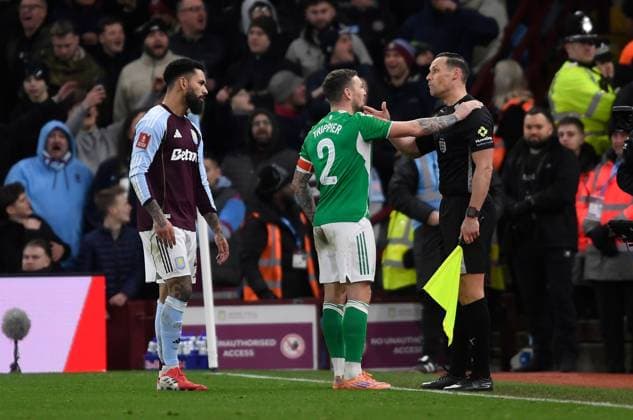 Kieran Trippier of Newcastle United speaks with referees assistant after decision to award a free kick and not a penalty after a hand ball by Lucas Digne of Aston Villa Aston Villa v Newcastle United, Emirates FA Cup, Fourth Round, Football, Villa Park, Birmingham, UK - 14 Feb 2026Birmingham Villa Park United Kingdom EDITORIAL USE ONLY No use with unauthorised audio, video, data, fixture lists, club league logos or live services. Online in-match use limited to 120 images, no video emulation. No use in betting, games or single club league player publications. Copyright: xAlanxWalter Shutterstockx 16608496co