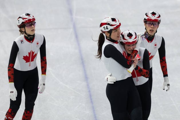 February 14, 2026, Milano, Lombardy, Italy: Courtney Sarault (14) of Canada and Kim Boutin (13) of Canada hugs after qualifying for the final in Short Track Speed skating, Eisschnelllauf Women 3000m relay during the semifinals during the 2026 Winter Olympics at the Milano Ice Skating Arena on Saturday in Milano. Olympics 2026: Milano Cortina: Short Track Speed Skating Women s  - ZUMAj89_ 20260214_oly_j89_037 Copyright: xPaulxKitagakixJr.x