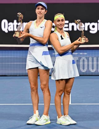 February 14, 2026, Doha, Qatar: Anna Danilina of Kazakhstan and Aleksandra Krunic of Serbia pose with their trophies after winning their Women s Doubles Final match against Su-Wei Hsieh of Chinese Taipei and Jelena Ostapenko of Latvia during the WTA, Tennis Damen Qatar TotalEnergies Open 2026 tennis tournament at the Khalifa International Tennis Complex. Anna Danilina Aleksandra Krunic won against Su-Wei Hsieh Jelena Ostapenko 0-6,6-4,10-8. Doha Qatar - ZUMAs197 20260214_aaa_s197_241 Copyright: xNoushadxVariyattiyakkalx