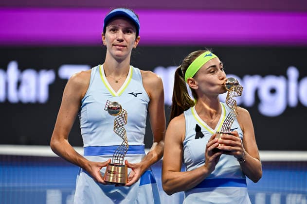 February 14, 2026, Doha, Qatar: Anna Danilina of Kazakhstan and Aleksandra Krunic of Serbia pose with their trophies after winning their Women s Doubles Final match against Su-Wei Hsieh of Chinese Taipei and Jelena Ostapenko of Latvia during the WTA, Tennis Damen Qatar TotalEnergies Open 2026 tennis tournament at the Khalifa International Tennis Complex. Anna Danilina Aleksandra Krunic won against Su-Wei Hsieh Jelena Ostapenko 0-6,6-4,10-8. Doha Qatar - ZUMAs197 20260214_aaa_s197_246 Copyright: xNoushadxVariyattiyakkalx