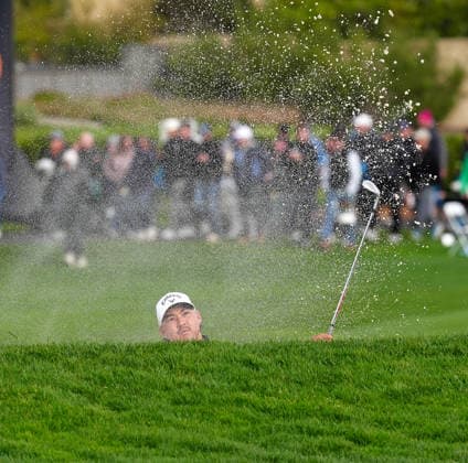 PEBBLE BEACH, CA - FEBRUARY 14: PGA, Golf Herren golfer Min Woo Lee hits out of a sand trap on the 18th hole on February 14, 2026, during the third round of the PGA AT&T Pebble Beach Pro-Am at the Pebble Beach Golf Links at Pebble Beach, California. (Photo by Brian Spurlock Icon Sportswire) GOLF: FEB 14 PGA AT&T Pebble Beach Pro-Am EDITORIAL USE ONLY Icon26021440