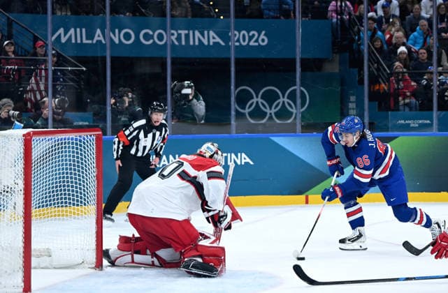 (260215) -- MILAN, Feb. 15, 2026 -- Jack Hughes (R) of the United States competes during the Ice hockey, Eishockey men s preliminary round group C match between the United States and Denmark of the Milan-Cortina 2026 Olympic Winter games, Winterspiele,Spiele, Summer games in Milan, Italy, Feb. 14, 2026. ) (MICO2026)ITALY-MILAN-OLYMPIC WINTER GAMES-ICE HOCKEY-MEN-PRELIMINARY-USA VS DEN ZhangxHaofu 