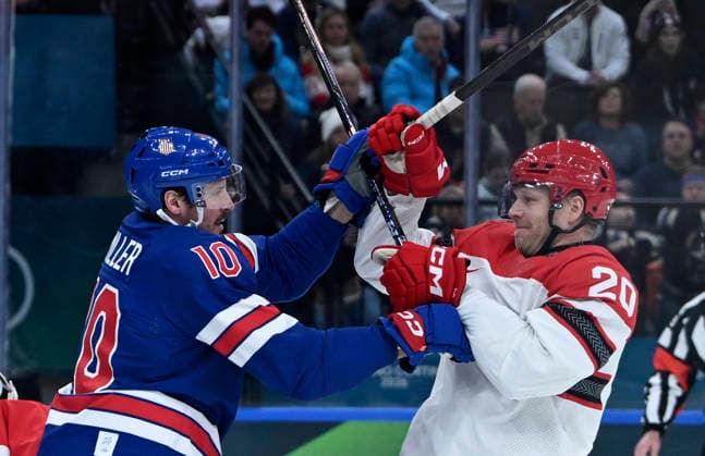 (260215) -- MILAN, Feb. 15, 2026 -- JT Miller (L) of the United States and Lars Eller of Denmark clash during the Ice hockey, Eishockey men s preliminary round group C match between the United States and Denmark of the Milan-Cortina 2026 Olympic Winter games, Winterspiele,Spiele, Summer games in Milan, Italy, Feb. 14, 2026. ) (MICO2026)ITALY-MILAN-OLYMPIC WINTER GAMES-ICE HOCKEY-MEN-PRELIMINARY-USA VS DEN ZhangxHaofu 