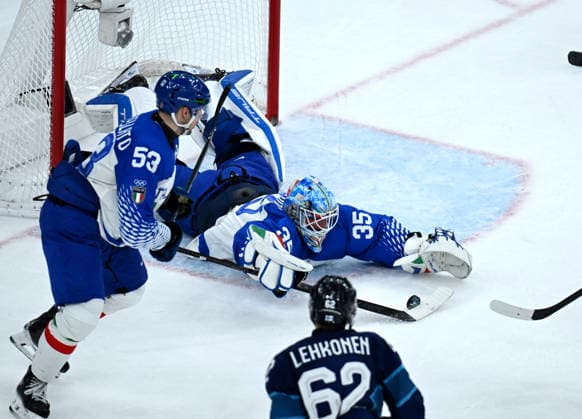 (260215) -- MILAN, Feb. 15, 2026 -- Davide Fadani (R, top), goalkeeper of Italy, makes a save during the Ice hockey, Eishockey men s preliminary round group B match between Italy and Finland of the Milan-Cortina 2026 Olympic Winter games, Winterspiele,Spiele, Summer games in Milan, Italy, Feb. 14, 2026. ) (MICO2026)ITALY-MILAN-OLYMPIC WINTER GAMES-ICE HOCKEY-MEN-PRELIMINARY-FIN VS ITA ZhangxHaofu 