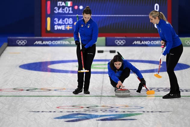(260215) -- CORTINA D AMPEZZO, Feb. 15, 2026 -- Stefania Constantini (C) of Italy competes during the curling women round robin session 5 match between Italy and Sweden at the 2026 Milan-Cortina Winter Olympics in Cortina, Italy, Feb. 14, 2026. ) (MICO2026)ITALY-CORTINA D AMPEZZO-OLYMPIC Winter games, Winterspiele,Spiele, Summer games CURLING-WOMEN-ROUND ROBIN LianxYi 