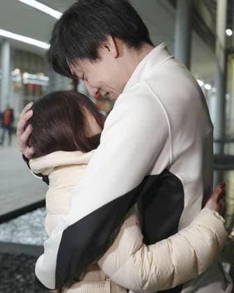 Milan Cortina Olympics: Speed skating, Eisschnelllauf Japanese speed skater Tatsuya Shinhama embraces his wife, Japanese curler Yurika Yoshida, after competing in the men s 500 meters at the Milan Cortina Olympics at Milano Speed Skating Stadium in Milan on Feb. 14, 2026.  A14AA0005286627P