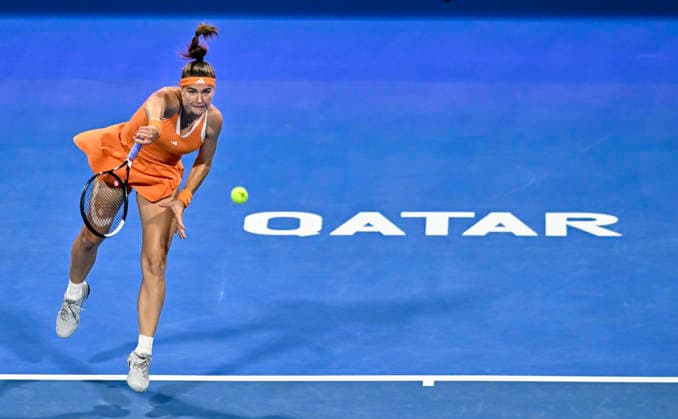 (260215) -- DOHA, Feb. 15, 2026 -- Karolina Muchova of the Czech Republic serves during the women s singles final match between Karolina Muchova of the Czech Republic and Victoria Mboko of Canada at the WTA, Tennis Damen Qatar Open 2026 tennis tournament in Doha, Qatar, on Feb. 14, 2026. (Photo by Xinhua) (SP)QATAR-DOHA-WTA QATAR OPEN 2026-SINGLES FINAL Nikku 