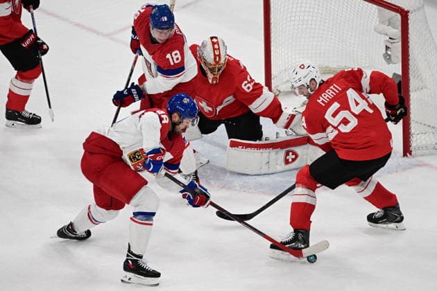 XXV Winter Olympic Games, Olympische Spiele, Olympia, OS in Milan, Italy, on February 15, 2026. Men s Ice hockey, Eishockey Group A, Switzerland vs Czech Republic. From left: Tomas Hertl (CZE), Ondrej Palat (CZE), goalkeeper Leonardo Genoni (SUI) and Christian Marti (SUI). (CTKxPhoto MichalxKamaryt) CTKPhotoP2026021503043  CTKPhotoP2026021503043