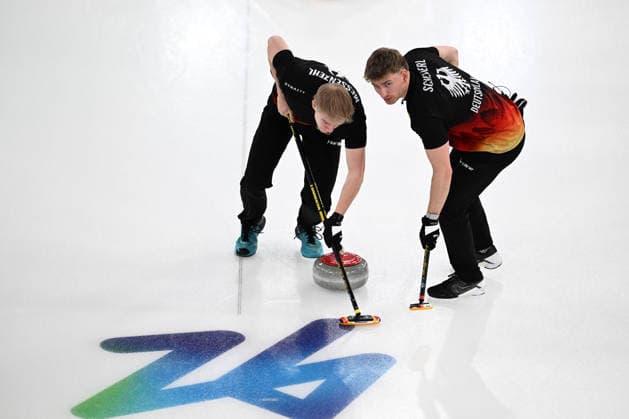 (260215) -- CORTINA D AMPEZZO, Feb. 15, 2026 -- Felix Messenzehl (L) and Johannes Scheuerl of Germany compete during the curling men round robin session 6 match between Germany and Britain at the 2026 Milan-Cortina Winter Olympics in Cortina, Italy, Feb. 15, 2026. ) (MICO2026)ITALY-CORTINA D AMPEZZO-OLYMPIC Winter games, Winterspiele,Spiele, Summer games CURLING-MEN-ROUND ROBIN-GER VS GBR LianxYi 