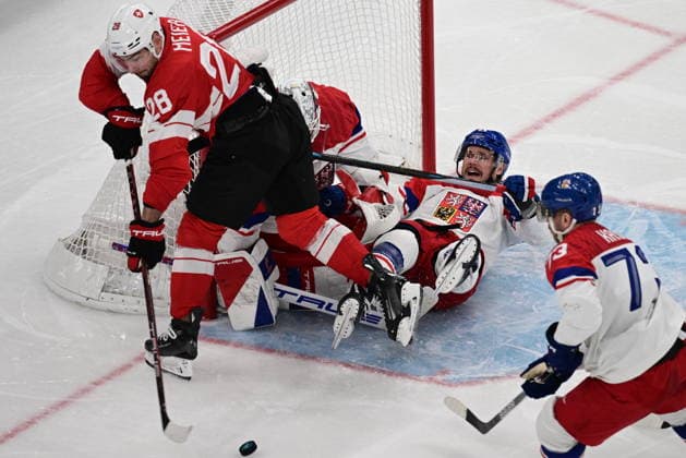 XXV Winter Olympic Games, Olympische Spiele, Olympia, OS in Milan, Italy, on February 15, 2026. Men s Ice hockey, Eishockey Group A, Switzerland vs Czech Republic. From left: Timo Meier (SUI), goalkeeper Lukas Dostal (CZE), Tomas Kundratek (CZE) and Ondrej Kase (CZE). (CTKxPhoto MichalxKamaryt) CTKPhotoP2026021503906  CTKPhotoP2026021503906