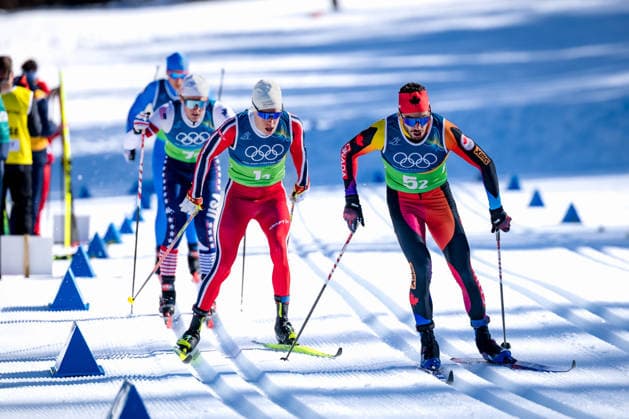 OLYMPICS - Winter Olympic Games, Olympische Spiele, Olympia, OS Milano Cortina 2026 TESERO,ITALY,15.FEB.26 - OLYMPICS, NORDIC SKIING, CROSS COUNTRY SKIING - Winter Olympic Games Milano Cortina 2026, 4X7.5km relay, men. Image shows Antoine Cyr (CAN), Martin Loewstroem Nyenget (NOR) and Gus Schumacher (USA).  GEPAxpictures xMatthiasxTrinkl