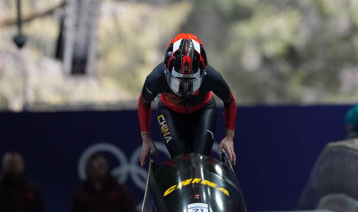 (260215) -- CORTINA D AMPEZZO, Feb. 15, 2026 -- Huai Mingming of China competes during the bobsleigh women s monobob heat at the 2026 Milan-Cortina Winter Olympics in Cortina, Italy, Feb. 15, 2026. ) (MICO2026)ITALY-CORTINA D AMPEZZO-OLYMPIC Winter games, Winterspiele,Spiele, Summer games BOBSLEIGH-WOMEN S MONOBOB-HEAT LixGang 