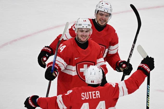 XXV Winter Olympic Games, Olympische Spiele, Olympia, OS in Milan, Italy, on February 15, 2026. Men s Ice hockey, Eishockey Group A, Switzerland vs Czech Republic. Scorer of the decisive goal in extra time, Dean Kukan (SUI), middle, receives congratulations from his teammates. Below Pius Suter (SUI), above Calvin Thurkauf (SUI). (CTKxPhoto MichalxKamaryt) CTKPhotoP2026021504454  CTKPhotoP2026021504454