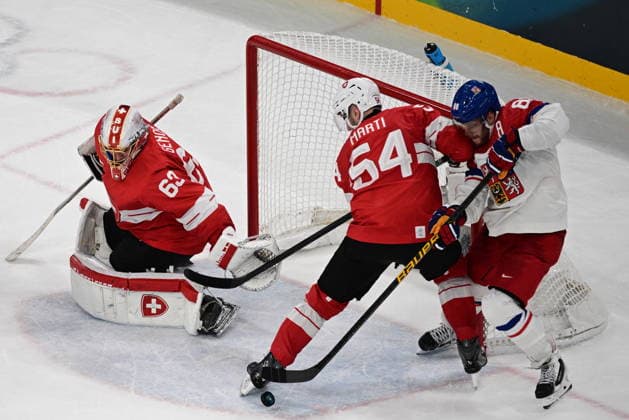 XXV Winter Olympic Games, Olympische Spiele, Olympia, OS in Milan, Italy, on February 15, 2026. Men s Ice hockey, Eishockey Group A, Switzerland vs Czech Republic. From left: goalkeeper Leonardo Genoni (SUI), Christian Marti (SUI) and David Pastrnak (CZE). (CTKxPhoto MichalxKamaryt) CTKPhotoP2026021504687  CTKPhotoP2026021504687