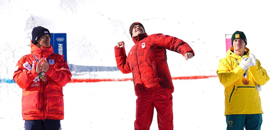 (260215) -- LIVIGNO, Feb. 15, 2026 -- Gold medalist Mikael Kingsbury (C) of Canada, silver medalist Horishima Ikuma (L) of Japan and bronze medalist Matt Graham of Australia react during the awarding ceremony for the freestyle skiing men s dual moguls at the Milan-Cortina 2026 Olympic Winter games, Winterspiele,Spiele, Summer games in Livigno, Italy, Feb. 15, 2026. ) (MICO2026)ITALY-LIVIGNO-OLYMPIC WINTER GAMES-FREESTYLE SKIING-MEN S DUAL MOGULS-FINALS WuxHuiwo 