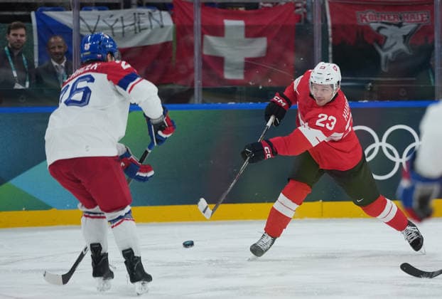 (260215) -- MILAN, Feb. 15, 2026 -- Jiri Tichacek (L) of the Czech Republic and Philipp Kurashev of Switzerland battle for the puck during the Ice hockey, Eishockey men s preliminary round group A match between Switzerland and the Czech Republic of the Milan-Cortina 2026 Olympic Winter games, Winterspiele,Spiele, Summer games in Milan, Italy, Feb. 15, 2026. ) (MICO2026)ITALY-MILAN-OLYMPIC WINTER GAMES-ICE HOCKEY-MEN-PRELIMINARY-SUI VS CZE TaoxXiyi 