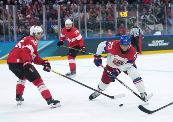 (260215) -- MILAN, Feb. 15, 2026 -- Lukas Sedlak (R) of the Czech Republic and Michael Fora of Switzerland battle for the puck during the Ice hockey, Eishockey men s preliminary round group A match between Switzerland and the Czech Republic of the Milan-Cortina 2026 Olympic Winter games, Winterspiele,Spiele, Summer games in Milan, Italy, Feb. 15, 2026. ) (MICO2026)ITALY-MILAN-OLYMPIC WINTER GAMES-ICE HOCKEY-MEN-PRELIMINARY-SUI VS CZE TaoxXiyi 