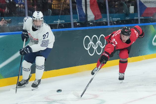 February 15, 2026, Milan, ITALY: Jules Boscq (27) of Team France and Connor McDavid (97) of Team Canada skate to the puck during first period Olympic hockey action at the 2026 Milan Cortina Winter Olympics in Milan, Italy on Sunday Feb. 15, 2026. Canada News - February 15, 2026  - ZUMAc35_ 20260215_zaf_c35_065 Copyright: xNathanxDenettex