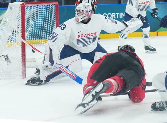February 15, 2026, Milan, ITALY: Tom Wilson (43) of Team Canada scores on Julian Junca (33) of Team France during first period Olympic hockey action at the 2026 Milan Cortina Winter Olympics in Milan, Italy on Sunday Feb. 15, 2026. Canada News - February 15, 2026  - ZUMAc35_ 20260215_zaf_c35_068 Copyright: xNathanxDenettex