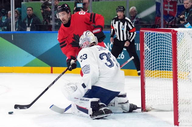 February 15, 2026, Milan, ITALY: Mark Stone (61) of Team Canada is stopped by Julian Junca (33) of Team France during second period Olympic hockey action at the 2026 Milan Cortina Winter Olympics in Milan, Italy on Sunday, February 15, 2026. Canada News - February 15, 2026  - ZUMAc35_ 20260215_zaf_c35_090 Copyright: xNathanxDenettex