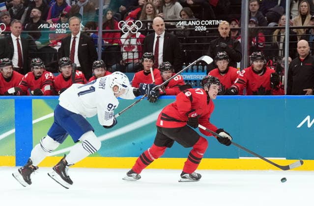 February 15, 2026, Milan, ITALY: Macklin Celebrini (17) of Team Canada skates past Floran Douay (91) of Team France during second period Olympic hockey action at the 2026 Milan Cortina Winter Olympics in Milan, Italy on Sunday, February 15, 2026. Canada News - February 15, 2026  - ZUMAc35_ 20260215_zaf_c35_095 Copyright: xNathanxDenettex