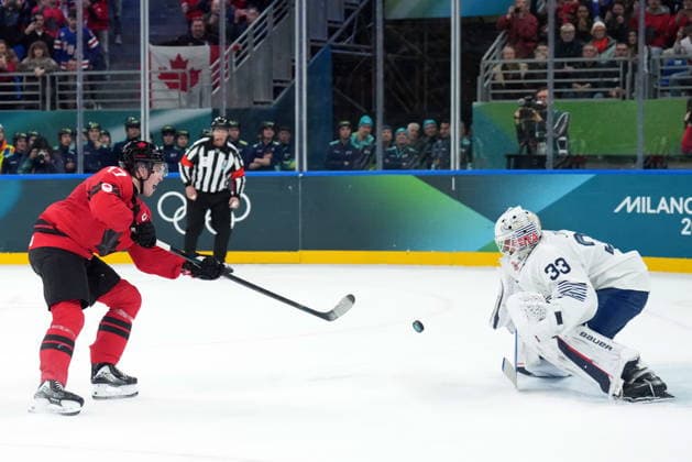 February 15, 2026, Milan, ITALY: Macklin Celebrini (17) of Team Canada scores a penalty shot against Julian Junca (33) of Team France during second period Olympic hockey action at the 2026 Milan Cortina Winter Olympics in Milan, Italy on Sunday, February 15, 2026. Canada News - February 15, 2026  - ZUMAc35_ 20260215_zaf_c35_100 Copyright: xNathanxDenettex