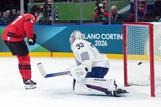 February 15, 2026, Milan, ITALY: Macklin Celebrini (17) of Team Canada scores a penalty shot against Julian Junca (33) of Team France during second period Olympic hockey action at the 2026 Milan Cortina Winter Olympics in Milan, Italy on Sunday, February 15, 2026. Canada News - February 15, 2026  - ZUMAc35_ 20260215_zaf_c35_101 Copyright: xNathanxDenettex