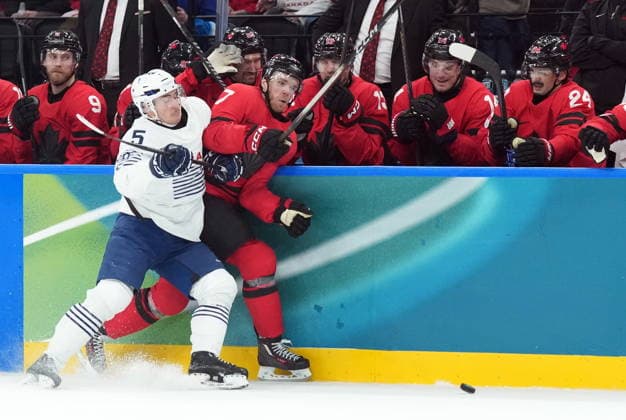 February 15, 2026, Milan, ITALY: Connor McDavid (97) of Team Canada is checked by Enzo Guebey (5) of Team France during second period Olympic hockey action at the 2026 Milan Cortina Winter Olympics in Milan, Italy on Sunday, February 15, 2026. Canada News - February 15, 2026  - ZUMAc35_ 20260215_zaf_c35_103 Copyright: xNathanxDenettex