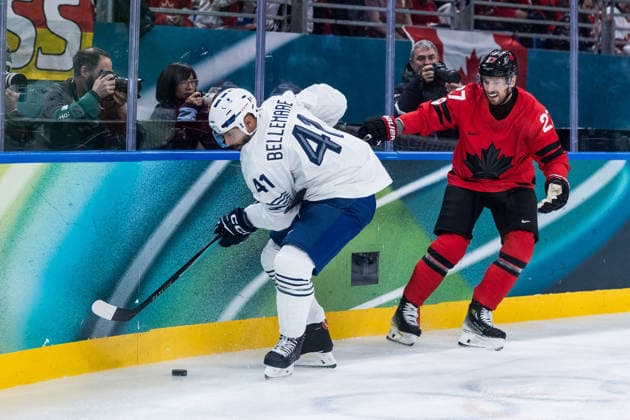 MILANO, ITALY - FEBRUARY 15: Pierre-Edouard Bellemare (France, 41) and Shea Theodore (Canada, 27) battle for the puck during the Ice hockey, Eishockey Men Canada vs France - Preliminary Round - Group A at the Milano Cortina 2026 Olympics at Milano Santagiulia Ice Hockey Arena on day 9 of the Milano Cortina 2026 Olympics on February 15, 2026 in Milano, Italy. Editorial use only. Italy Copyright: xSteffiexWunderlx