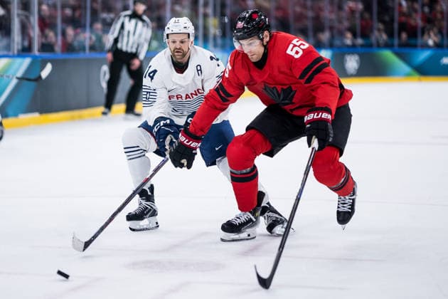 MILANO, ITALY - FEBRUARY 15: Colton Parayko (Canada, 55) controls the puck against Stephane da Costa (France, 14) during the Ice hockey, Eishockey Men Canada vs France - Preliminary Round - Group A at the Milano Cortina 2026 Olympics at Milano Santagiulia Ice Hockey Arena on day 9 of the Milano Cortina 2026 Olympics on February 15, 2026 in Milano, Italy. Editorial use only. Italy Copyright: xSteffiexWunderlx