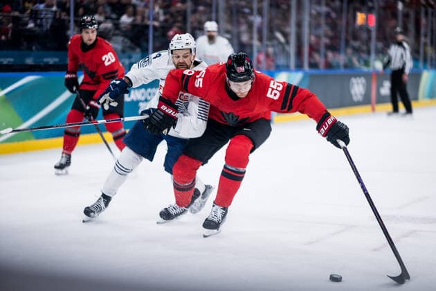 MILANO, ITALY - FEBRUARY 15: Colton Parayko (Canada, 55) controls the puck against Stephane da Costa (France, 14) during the Ice hockey, Eishockey Men Canada vs France - Preliminary Round - Group A at the Milano Cortina 2026 Olympics at Milano Santagiulia Ice Hockey Arena on day 9 of the Milano Cortina 2026 Olympics on February 15, 2026 in Milano, Italy. Editorial use only. Italy Copyright: xSteffiexWunderlx