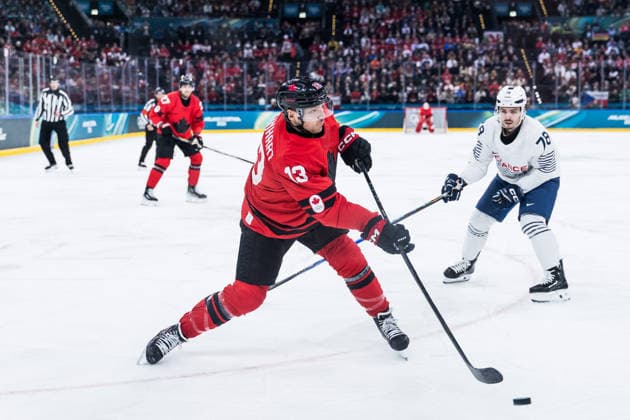 MILANO, ITALY - FEBRUARY 15: Sam Reinhart (Canada, 13) controls the puck shoots during the Ice hockey, Eishockey Men Canada vs France - Preliminary Round - Group A at the Milano Cortina 2026 Olympics at Milano Santagiulia Ice Hockey Arena on day 9 of the Milano Cortina 2026 Olympics on February 15, 2026 in Milano, Italy. Editorial use only. Italy Copyright: xSteffiexWunderlx
