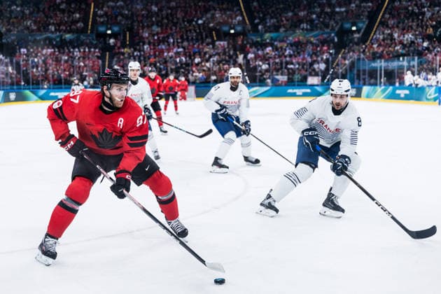MILANO, ITALY - FEBRUARY 15: Drew Doughty (Canada, 89) controls the puck against Hugo Gallet (France, 8) during the Ice hockey, Eishockey Men Canada vs France - Preliminary Round - Group A at the Milano Cortina 2026 Olympics at Milano Santagiulia Ice Hockey Arena on day 9 of the Milano Cortina 2026 Olympics on February 15, 2026 in Milano, Italy. Editorial use only. Italy Copyright: xSteffiexWunderlx