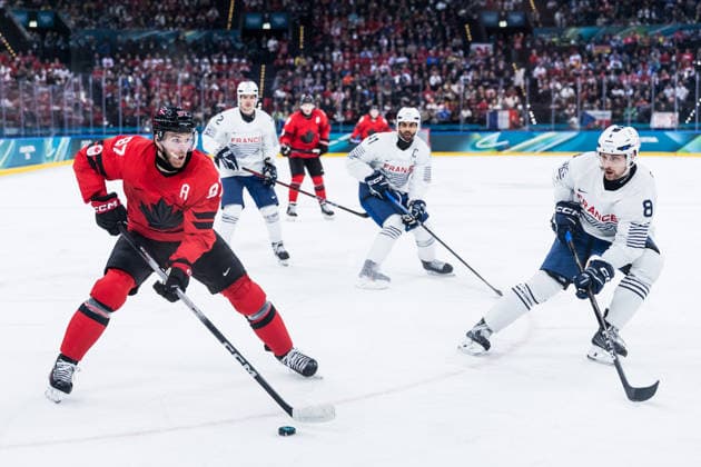 MILANO, ITALY - FEBRUARY 15: Drew Doughty (Canada, 89) controls the puck against Hugo Gallet (France, 8) during the Ice hockey, Eishockey Men Canada vs France - Preliminary Round - Group A at the Milano Cortina 2026 Olympics at Milano Santagiulia Ice Hockey Arena on day 9 of the Milano Cortina 2026 Olympics on February 15, 2026 in Milano, Italy. Editorial use only. Italy Copyright: xSteffiexWunderlx