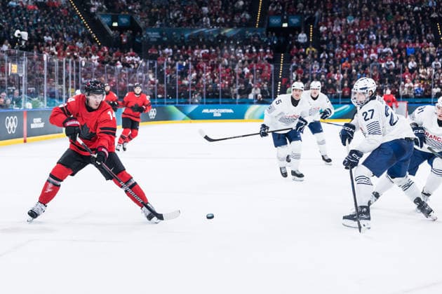 MILANO, ITALY - FEBRUARY 15: Bo Horvat (Canada, 14) controls the puck against Jules Boscq (France, 27) during the Ice hockey, Eishockey Men Canada vs France - Preliminary Round - Group A at the Milano Cortina 2026 Olympics at Milano Santagiulia Ice Hockey Arena on day 9 of the Milano Cortina 2026 Olympics on February 15, 2026 in Milano, Italy. Editorial use only. Italy Copyright: xSteffiexWunderlx